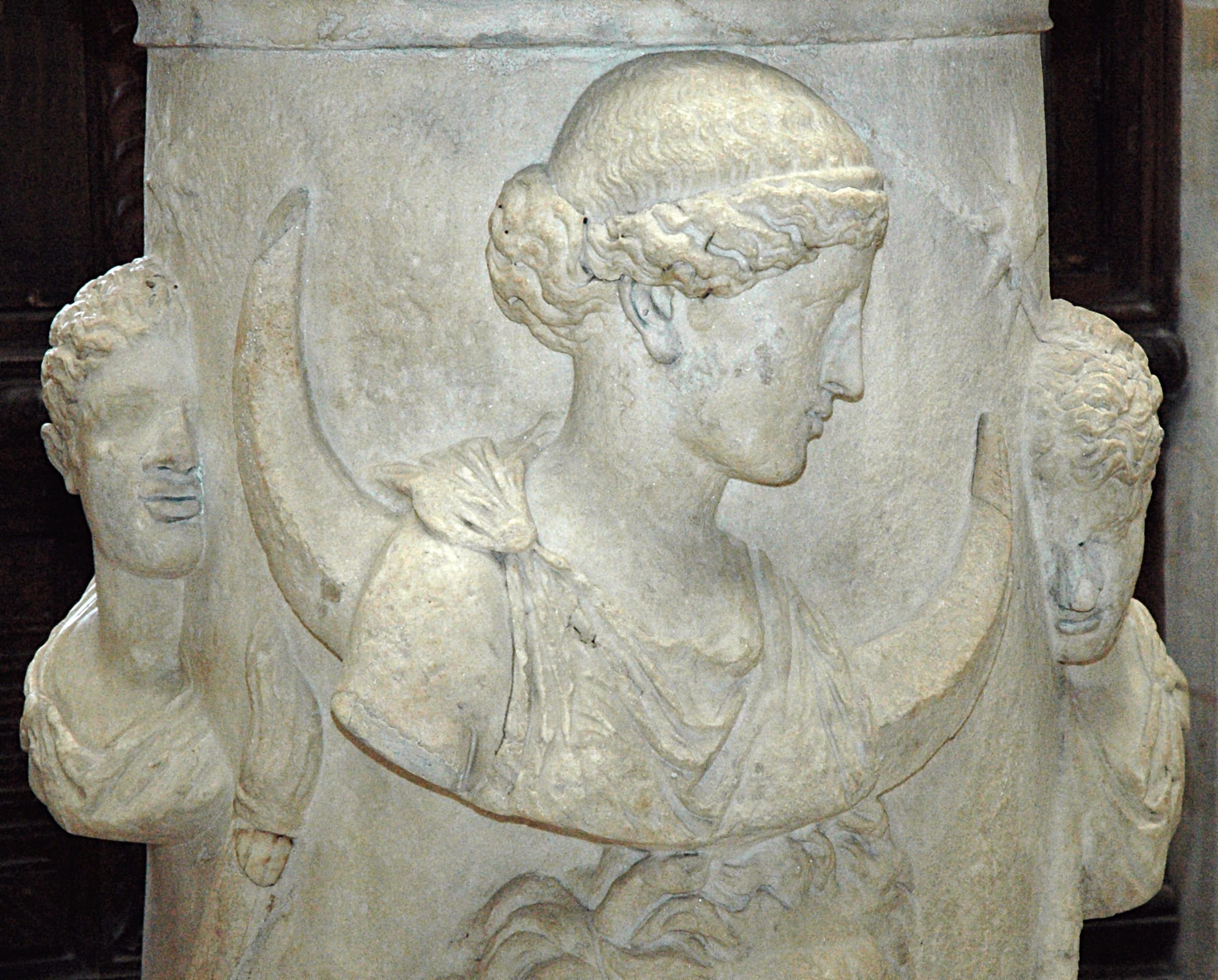 The Moon-goddess Selene or Luna accompanied by the Dioscuri, or Phosphoros (the Morning Star) and Hesperos (the Evening Star). Marble altar, Roman artwork, 2nd century AD. From Italy.