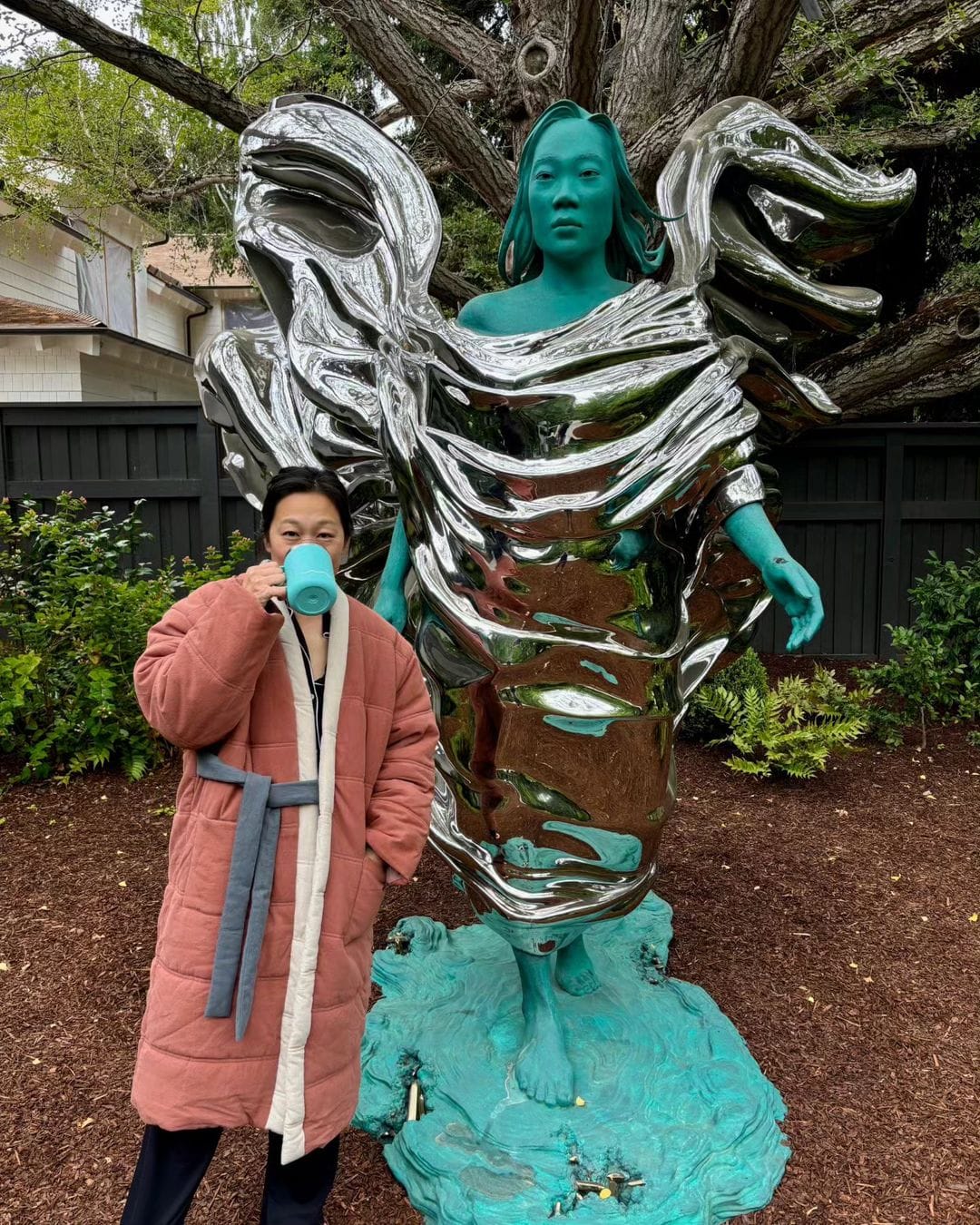 Priscilla Chan, next to the sculpture built in her honour by Mark Zuckerberg