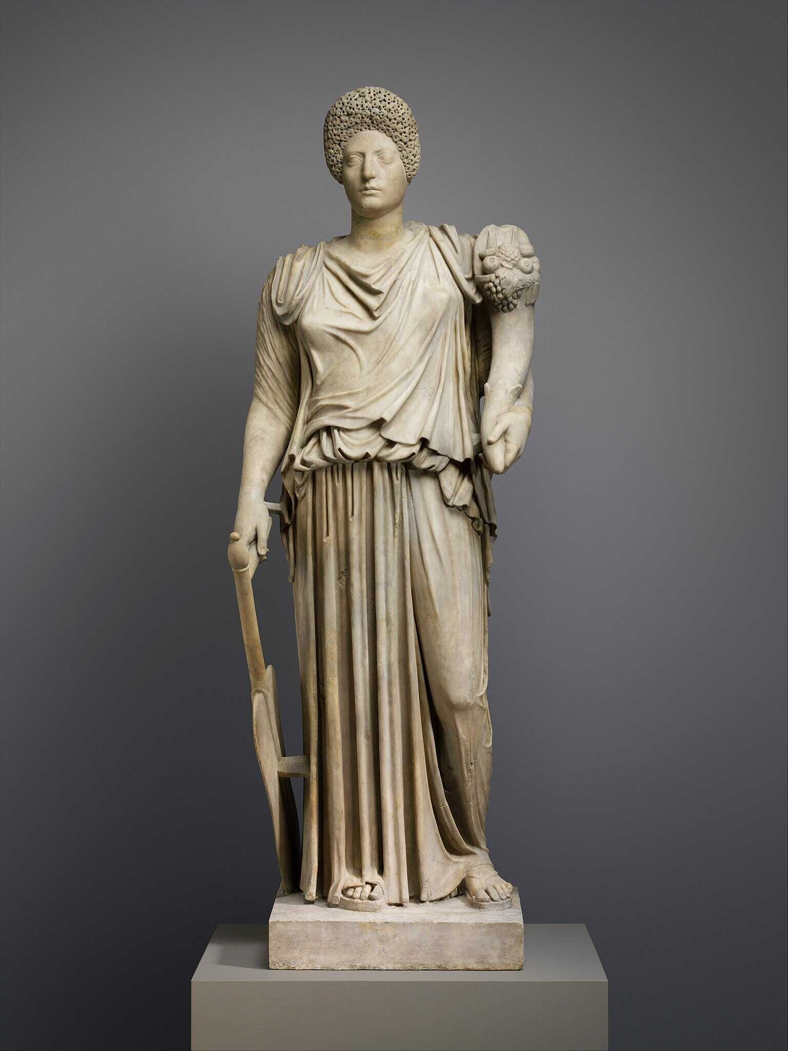 Roman Marble statue of Tyche-Fortuna restored with the portrait head of a woman