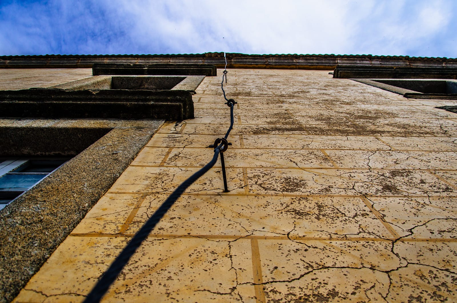 A lightning rod cable used for grounding, on the side of an old building in Béjar, Spain.