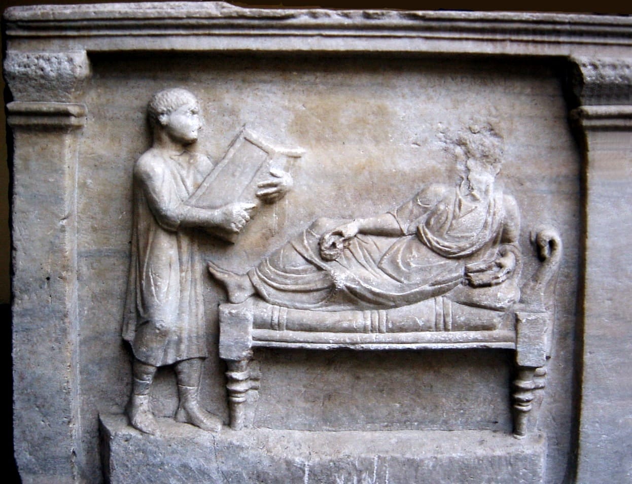 Sarcophagus relief of Valerius Petronianus, with his slave holding writing tablets (4th century AD)