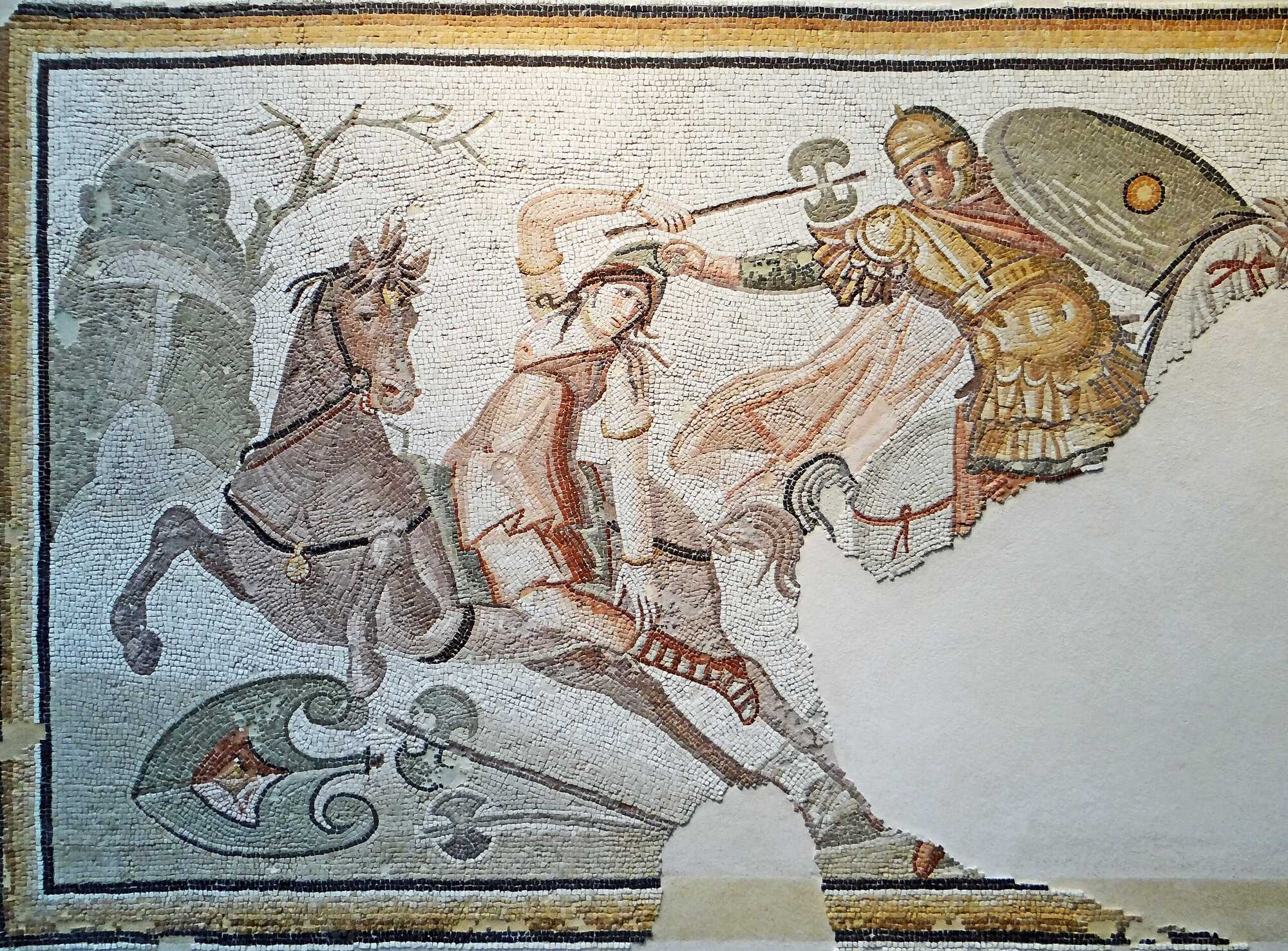 An Amazon warrior in battle, seized by her Phrygian cap, Roman mosaic emblema from Daphne, a suburb of Antioch, modern Turkey