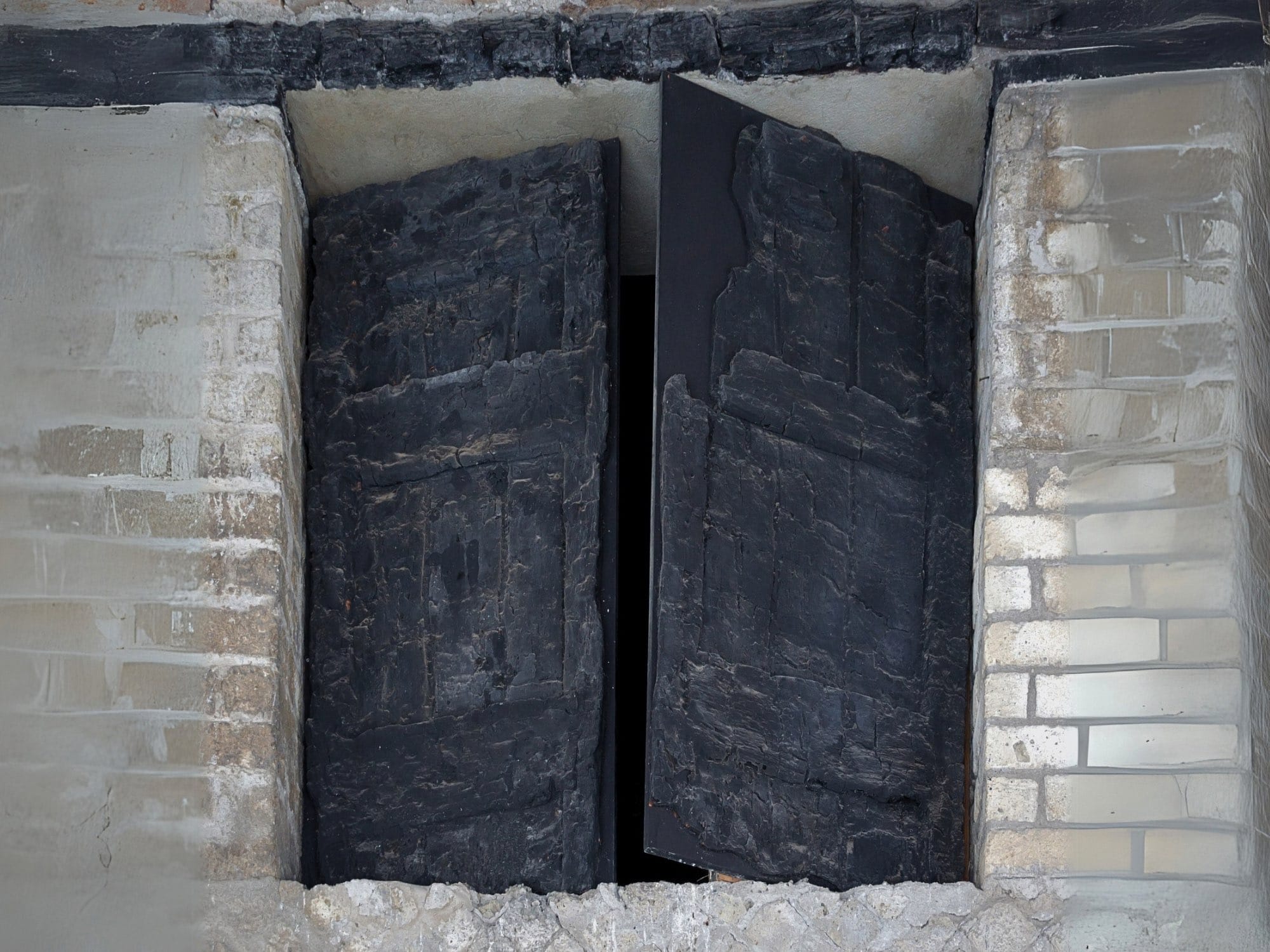 Charred Ancient Roman window shutters of a house in Herculaneum