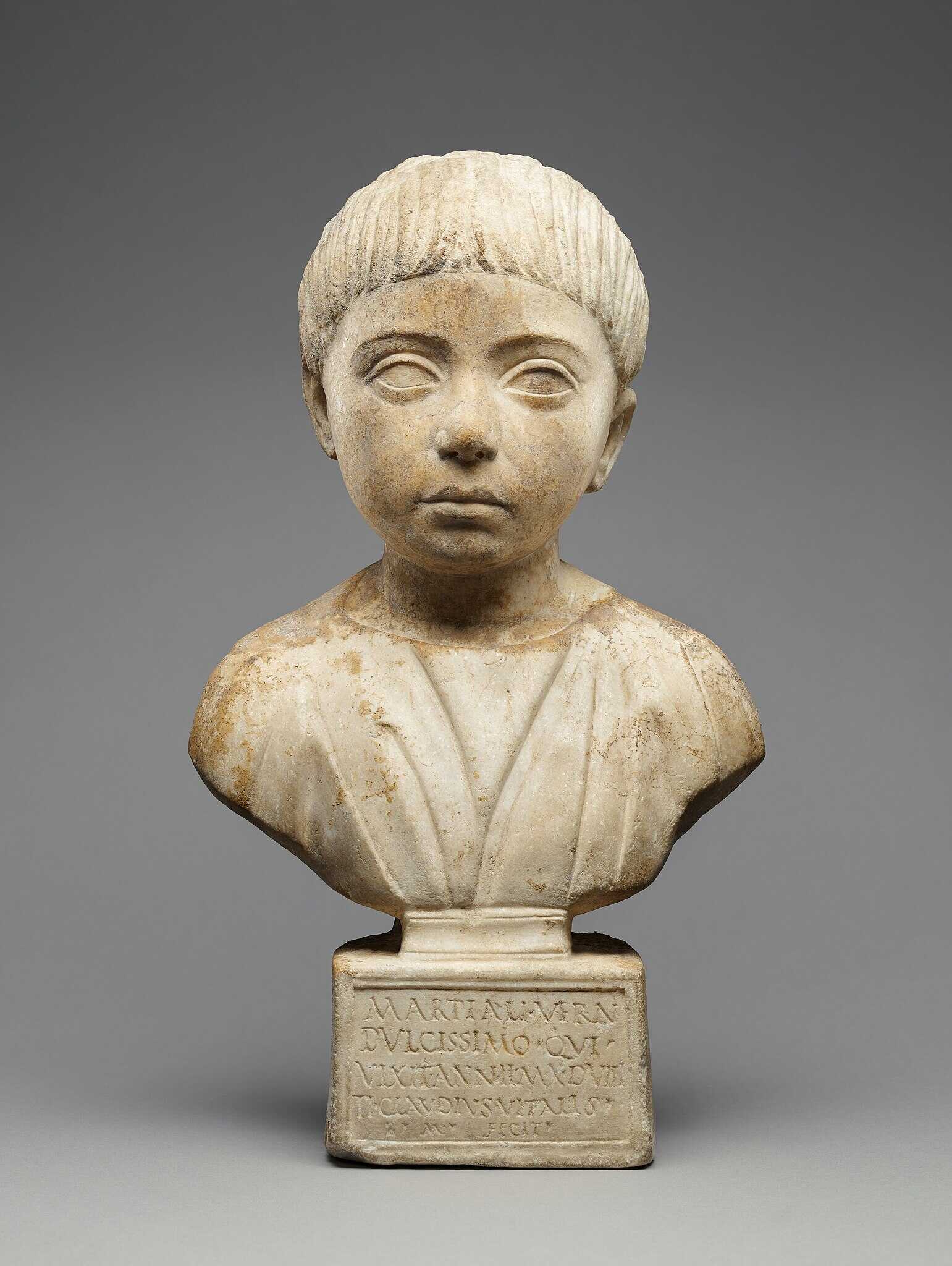 An Ancient Roman portrait bust of a house-born slave child, named Martial, who lived two years, ten months, and eight days, and was probably the child of the house owner and an enslaved mother