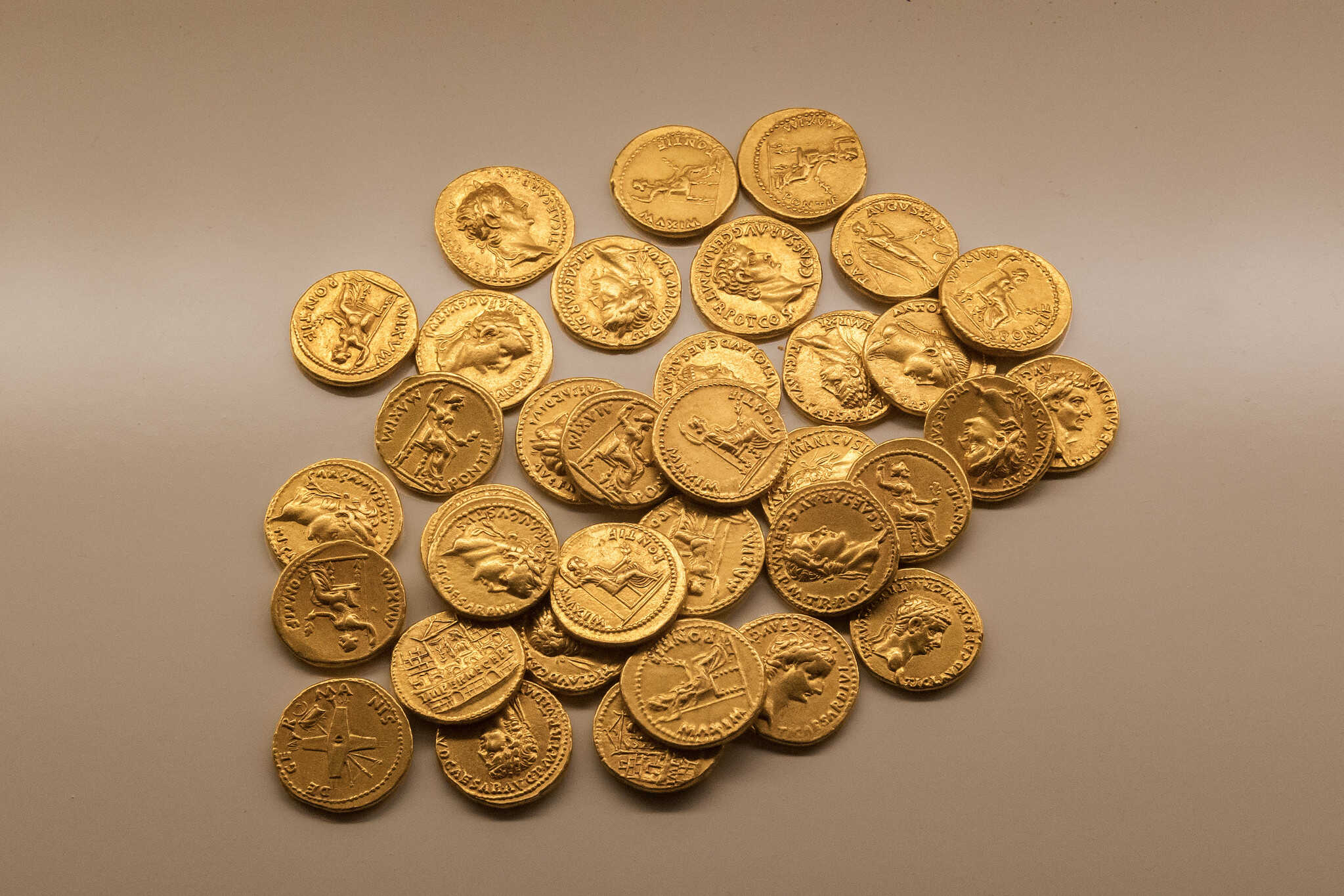 Buried Roman treasure with gold Aureus coins of Emperors Tiberius, Caligula, Claudius, Nero Drusus and Augusta Antonia