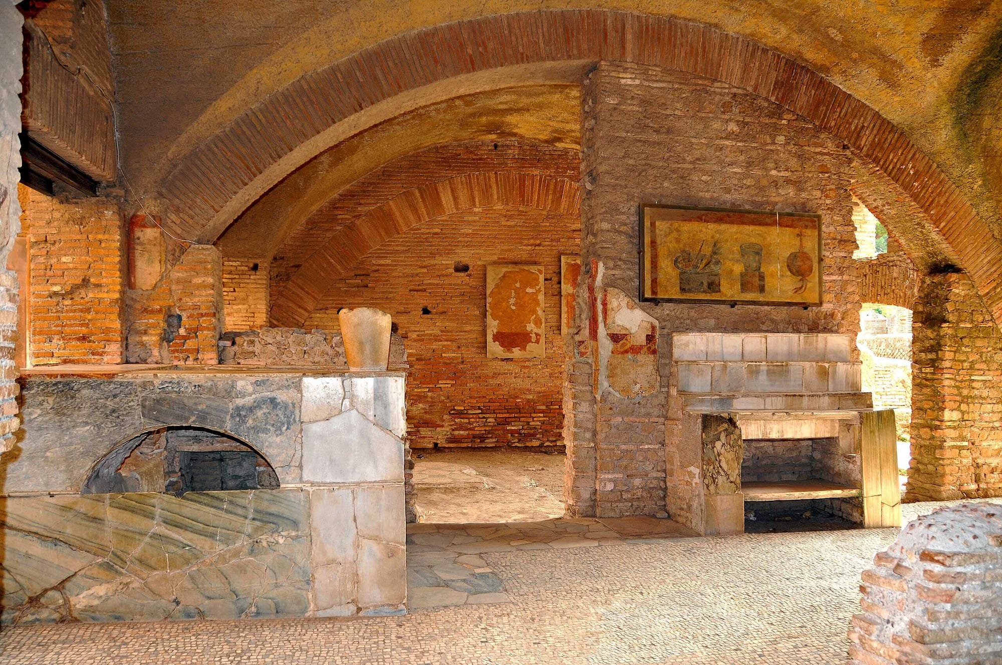 This Roman Thermopolium, in a prime position near the Forum, sold hot food and drinks, in the centre is the bar counter
