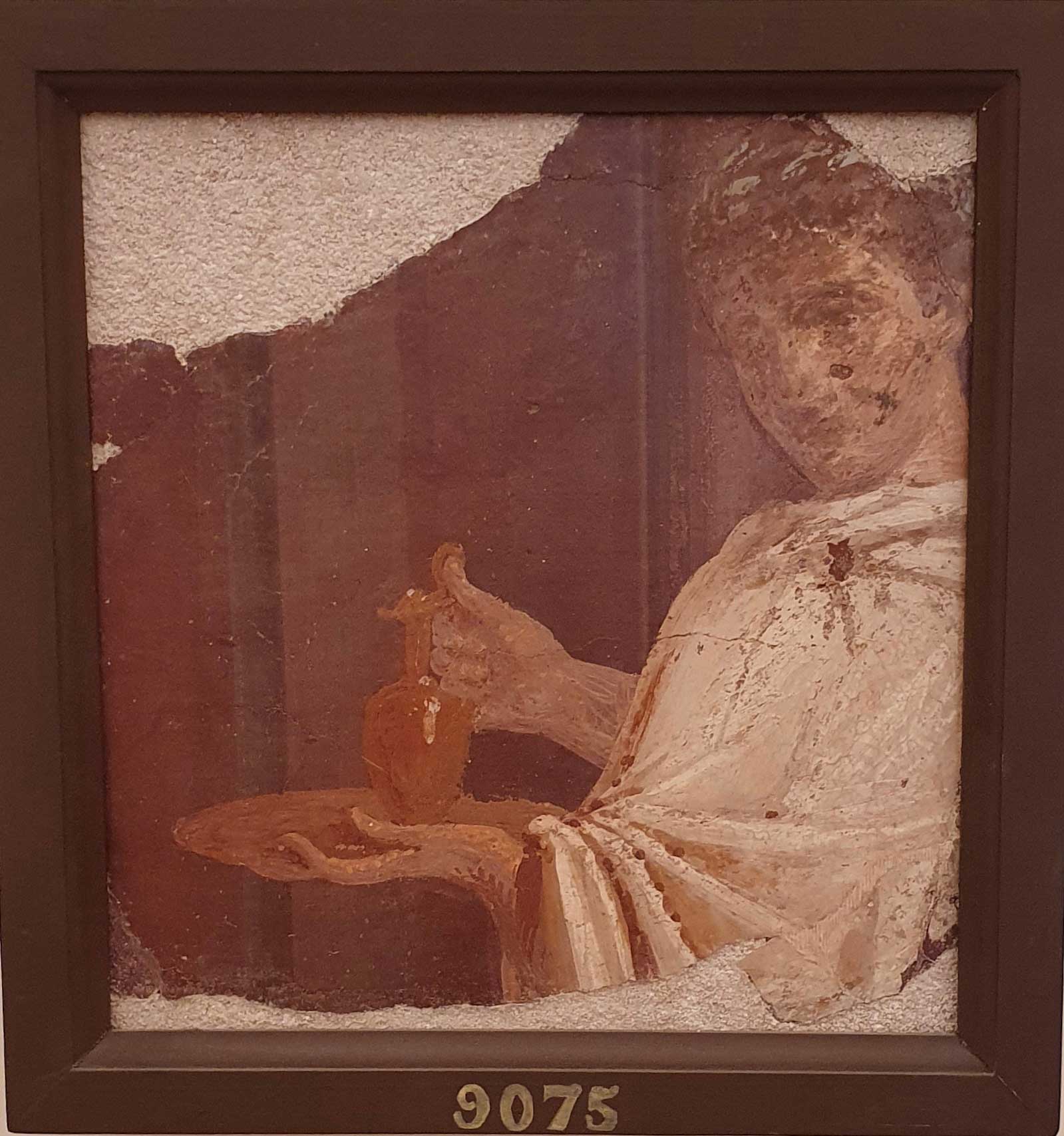 Fresco of young assistant to the sacred ritual bearing a jug in his hands from Herculaneum