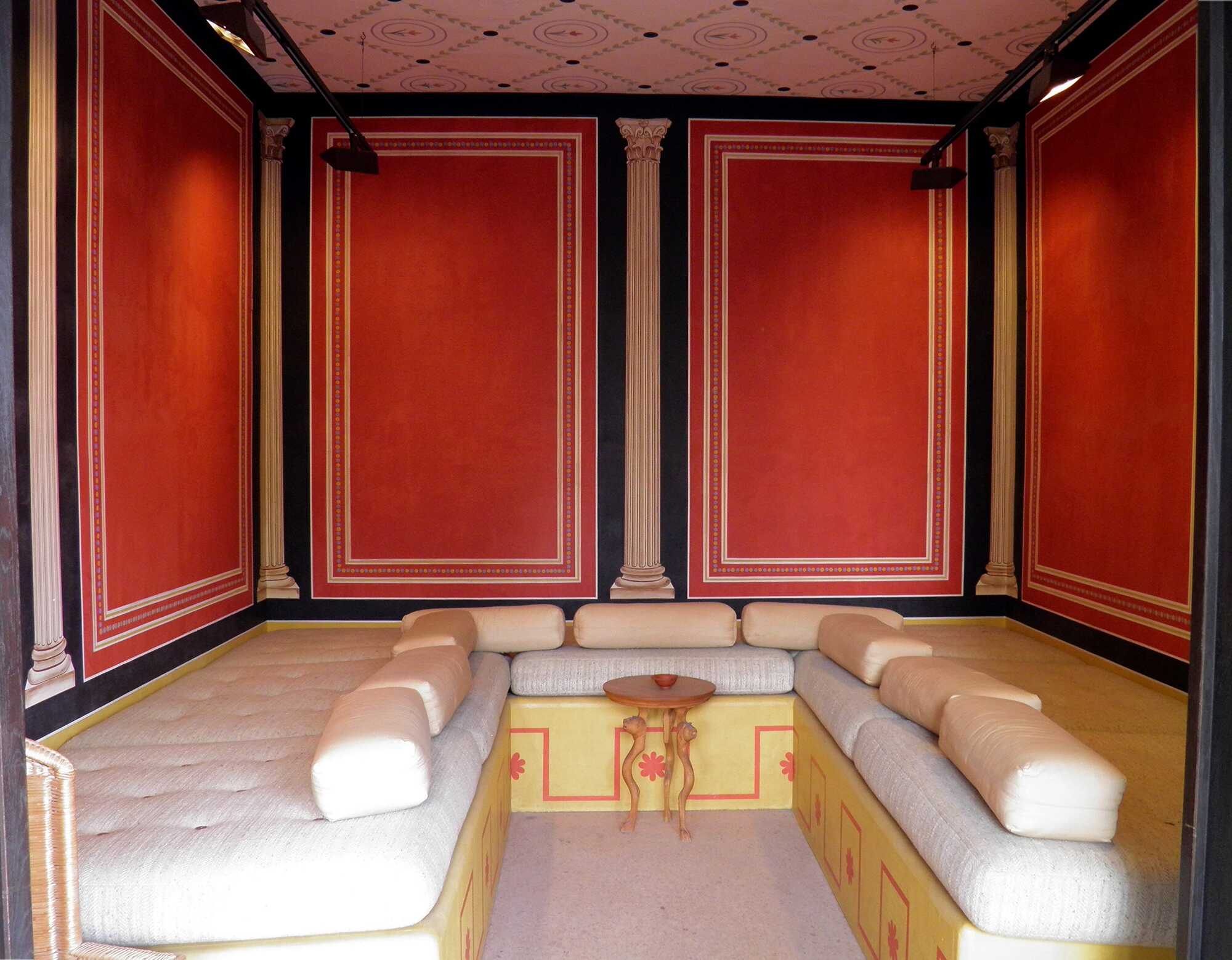Reconstructed Dining Room containing three couches made of wood, Xanten, Germany