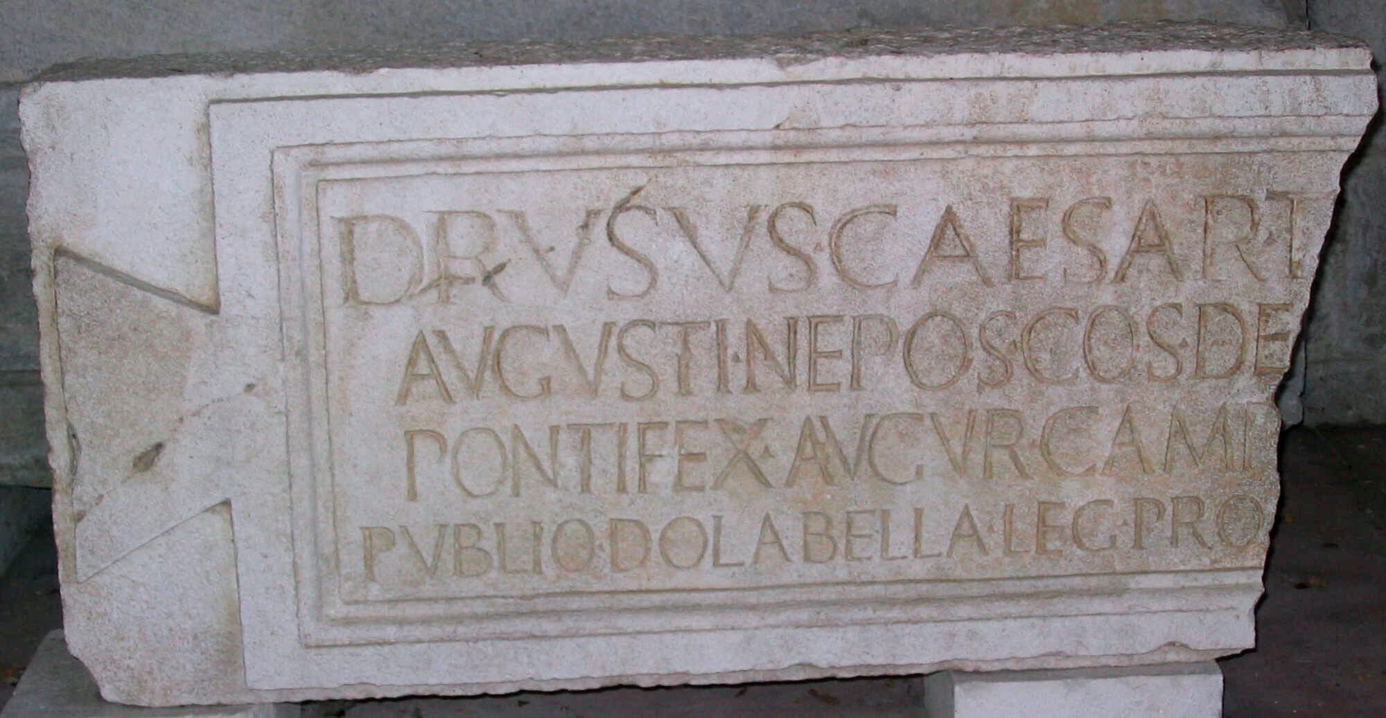 Latin inscription from the Roman period discovered in 1952 on the island of Vis (ancient Issa ) and preserved in the Archaeological Museum of Split. Latin text: "Drusus Caesar, T[(iberii) Aug(usti) f(ilius), Diui] / Augusti nepos, consul de[sign(atus) II], / pontifex, augur, camp[um dedit] / Publio Dolabella leg(ato) pro[praetore].