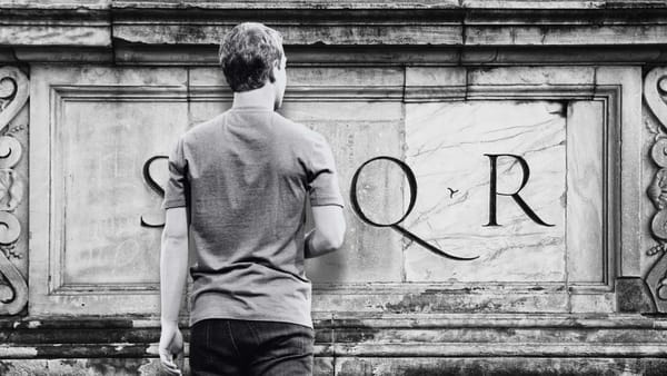 Mark Zuckerberg facing a Roman wall with the SPQR lettering on it