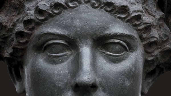 A closeup photo of one of Agrippina the Younger's busts. focusing on her piercing gaze. 