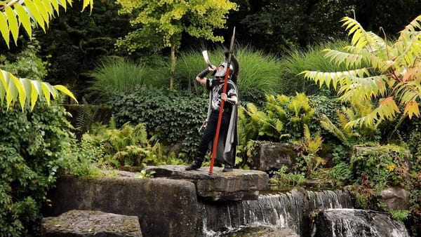 An ancient warrior blowing his horn